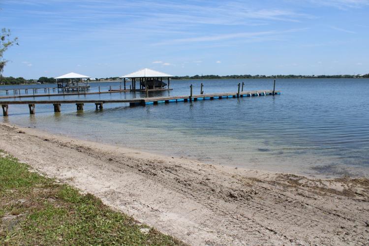 This is what the project looked like after SF Aquatics finished clearing the weeds from the lakefront and created a beach for the landowner.