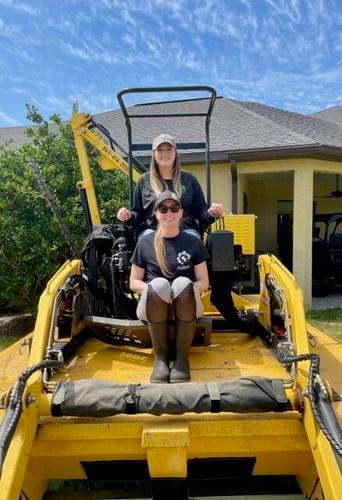 Stephanie Seeber, in back, and her sister Valerie Cobb manage the business operation of SF Aquatics but they are known to roll up their sleeves and work in the field when needed. Seeber is co-owner of SF Aquatics.