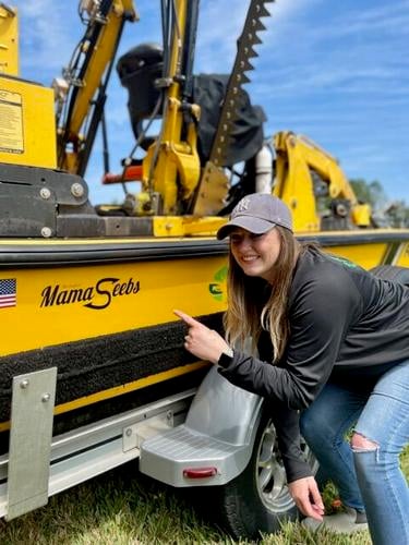 Stephanie Seeber, also known as “Mama Seeber” to her family, shows where her name was placed on the Weedoo in her honor.